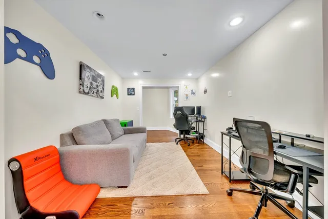 a living room with furniture and a rug