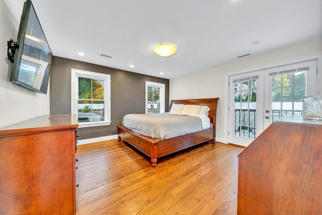 4 Lowell Street Lynnfield, MA 01940 - Photo 17 of 42 a bedroom with a large bed and a window