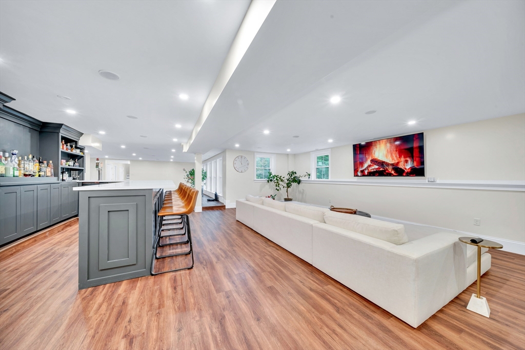 4 Lowell Street Lynnfield, MA 01940 - Photo 25 of 42 a living room with furniture and a flat screen tv