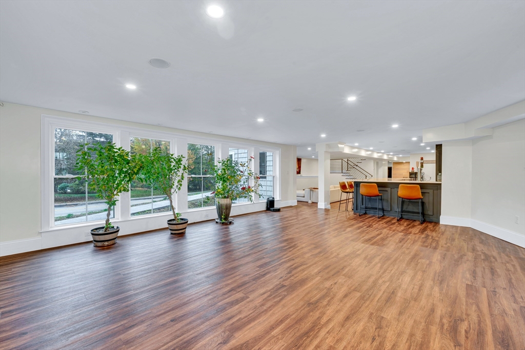 4 Lowell Street Lynnfield, MA 01940 - Photo 27 of 42 a view of a room with gym equipment and floor to ceiling window