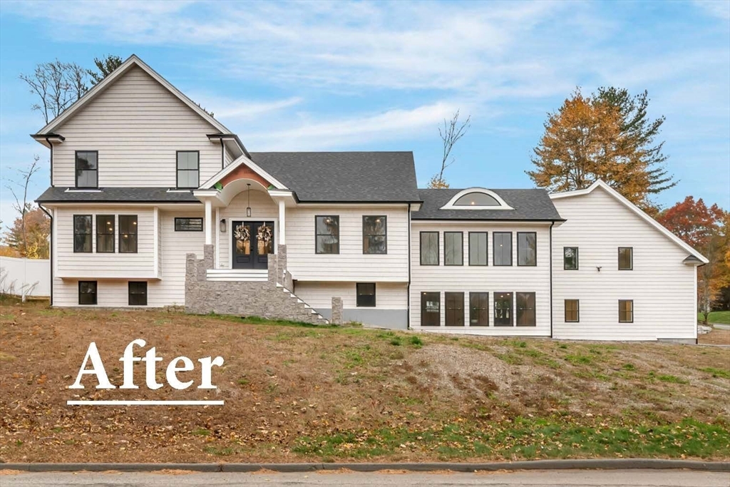 4 Lowell Street Lynnfield, MA 01940 - Photo 42 of 42 a view of a white house with a large window and large tree