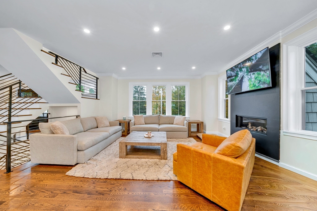 4 Lowell Street Lynnfield, MA 01940 - Photo 8 of 42 a living room with furniture and a flat screen tv