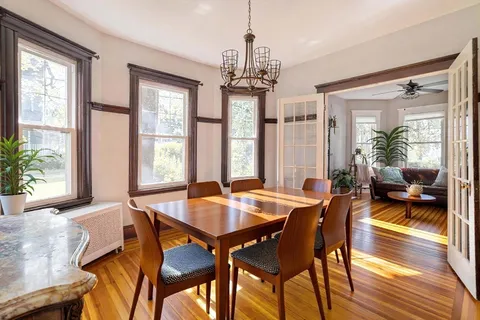 a view of livingroom with furniture wooden floor and windows