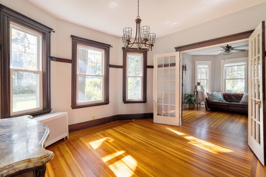 250 Poplar Street, Unit 1 Boston, MA 02131 - Photo 22 of 34 a view of livingroom with furniture wooden floor and windows