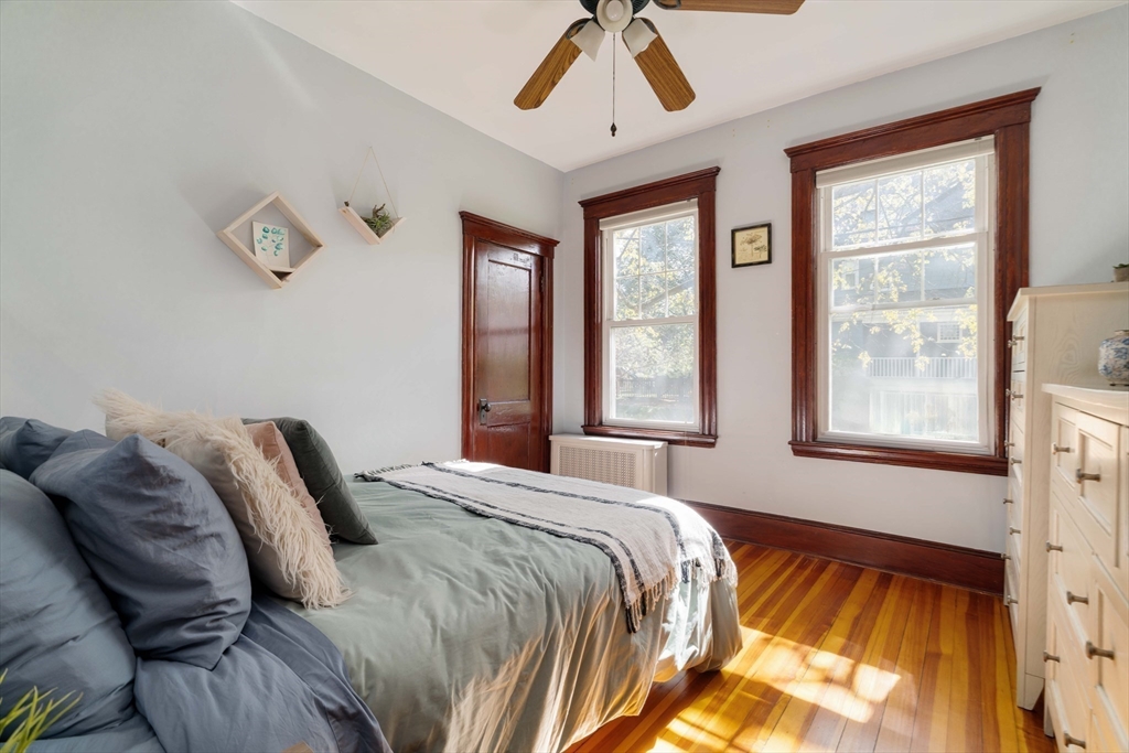 250 Poplar Street, Unit 1 Boston, MA 02131 - Photo 23 of 34 a bedroom with a bed and a window