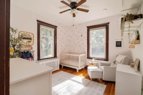 a bedroom with furniture and a window