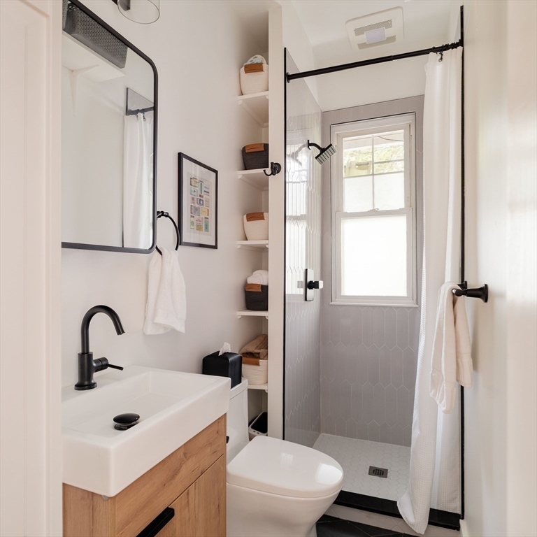 250 Poplar Street, Unit 1 Boston, MA 02131 - Photo 28 of 34 a bathroom with a sink toilet and shower