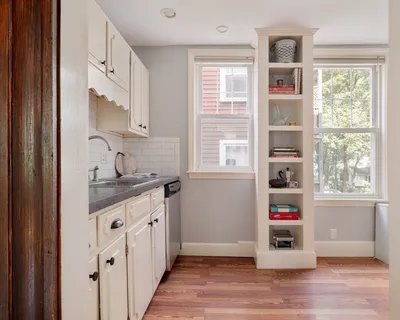 a kitchen with granite countertop a window and a sink