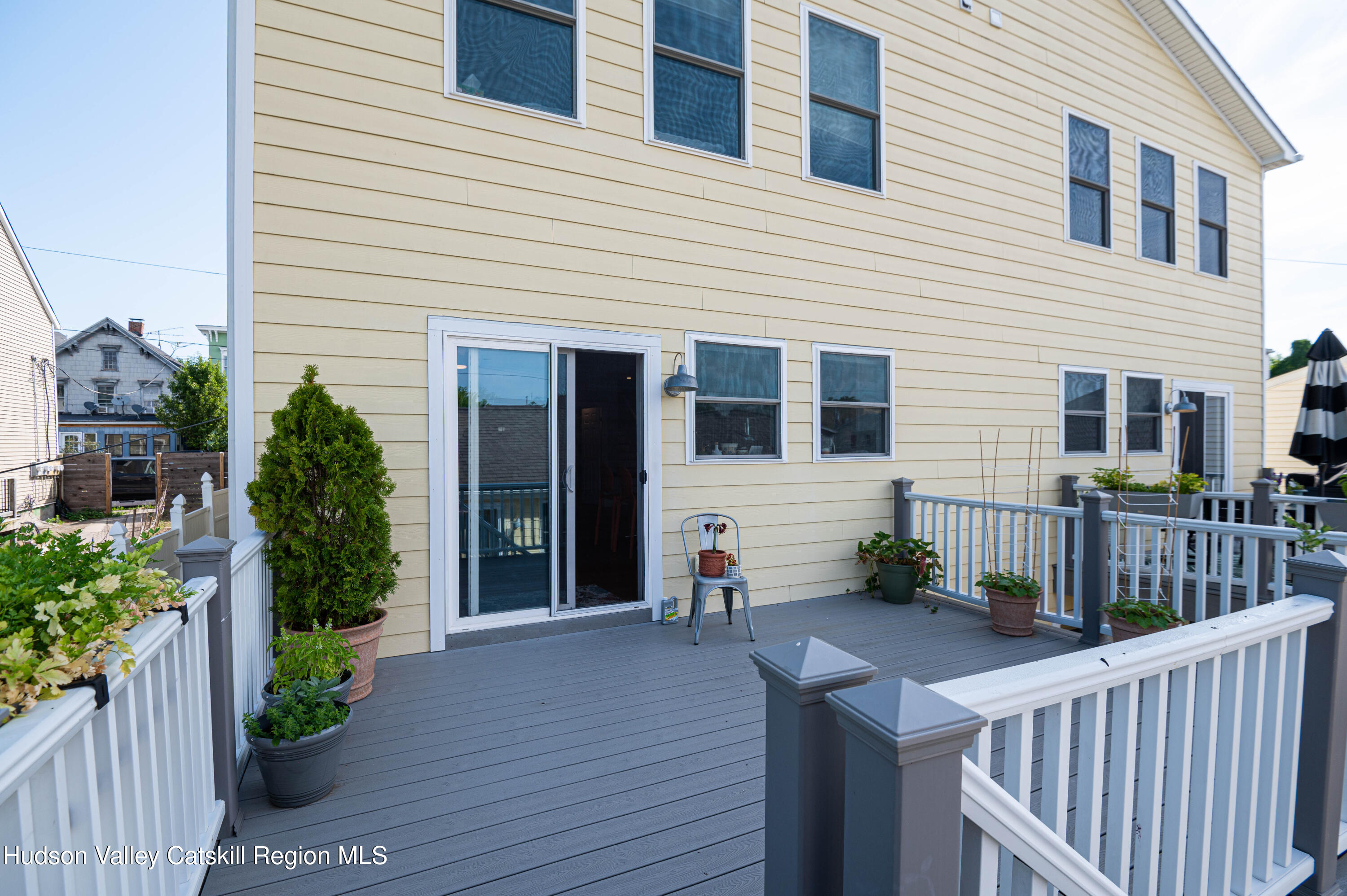 225 State Street, Unit RIGHT Hudson, NY 12534 - Photo 1 of 29 a view of house with patio outdoor seating and plants