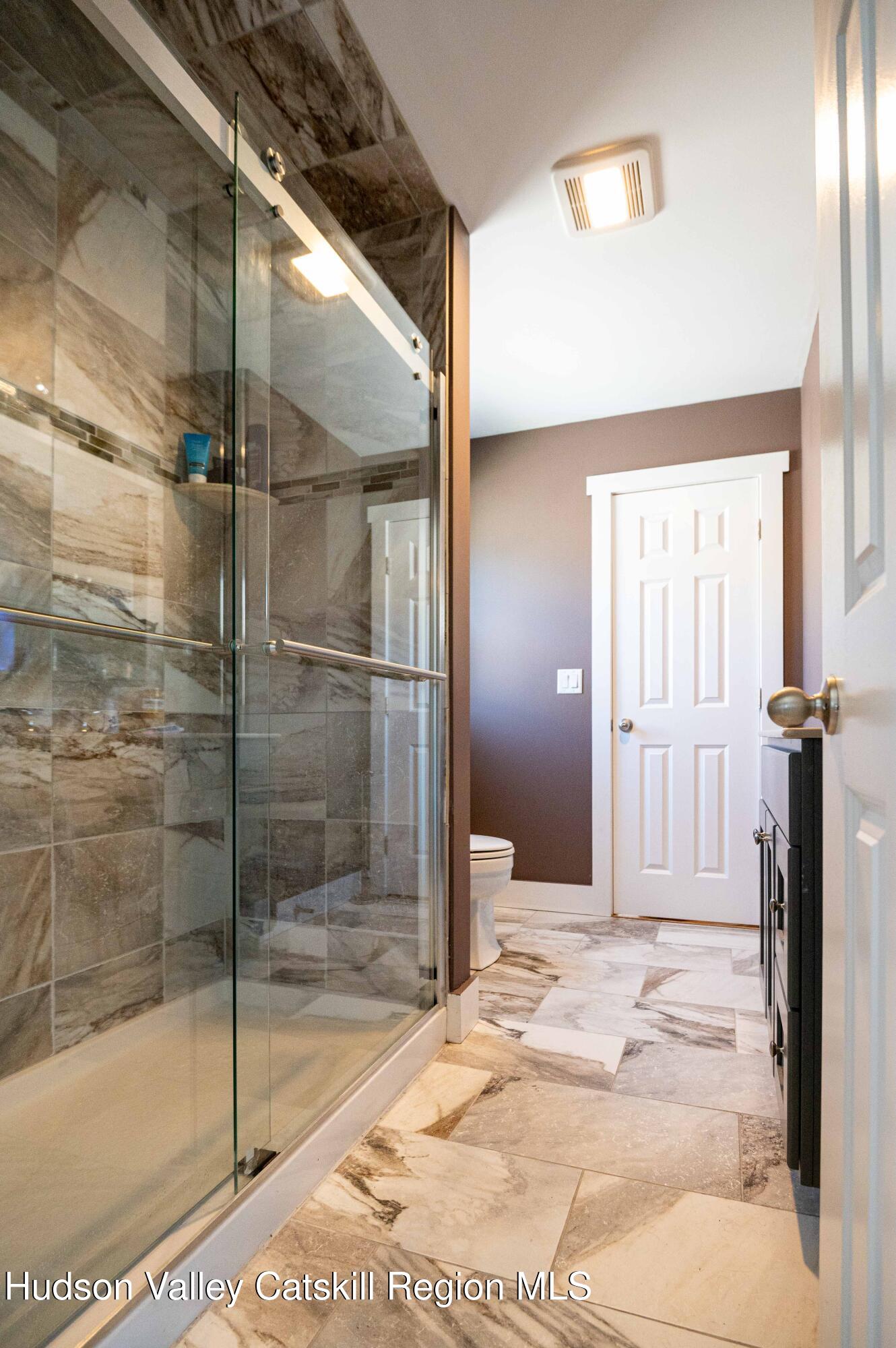 225 State Street, Unit RIGHT Hudson, NY 12534 - Photo 17 of 29 a bathroom with a shower