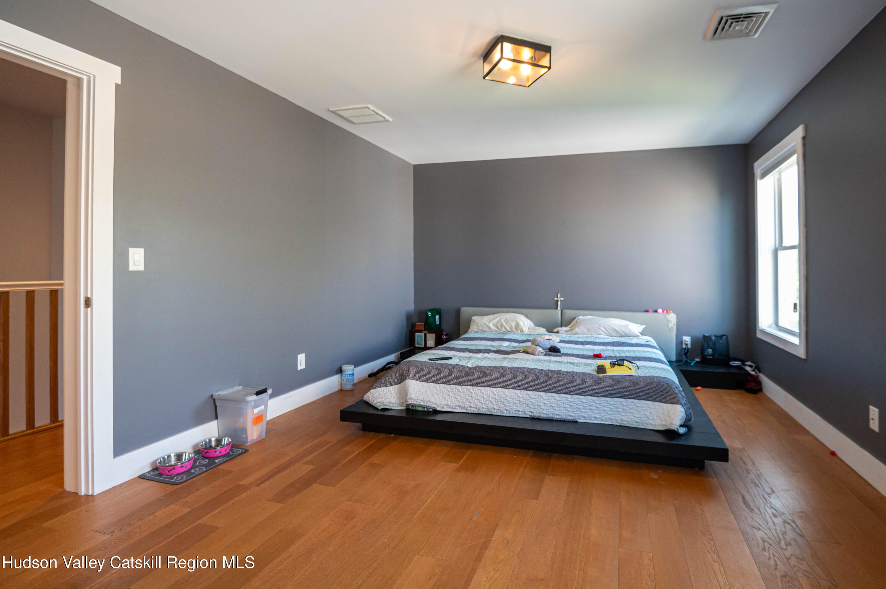 225 State Street, Unit RIGHT Hudson, NY 12534 - Photo 18 of 29 a bedroom with a bed and a window