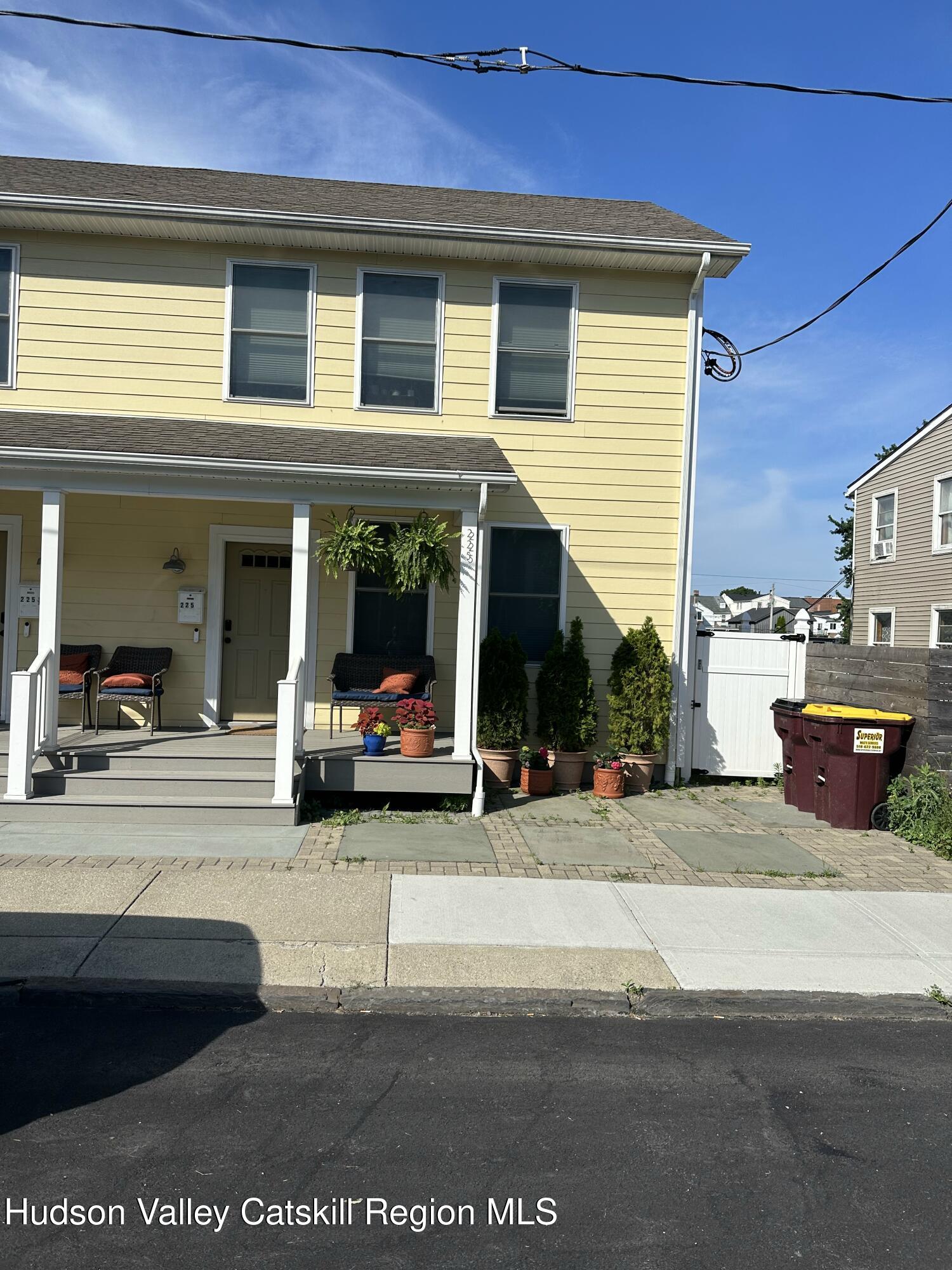 225 State Street, Unit RIGHT Hudson, NY 12534 - Photo 2 of 29 a view of a building with car parked