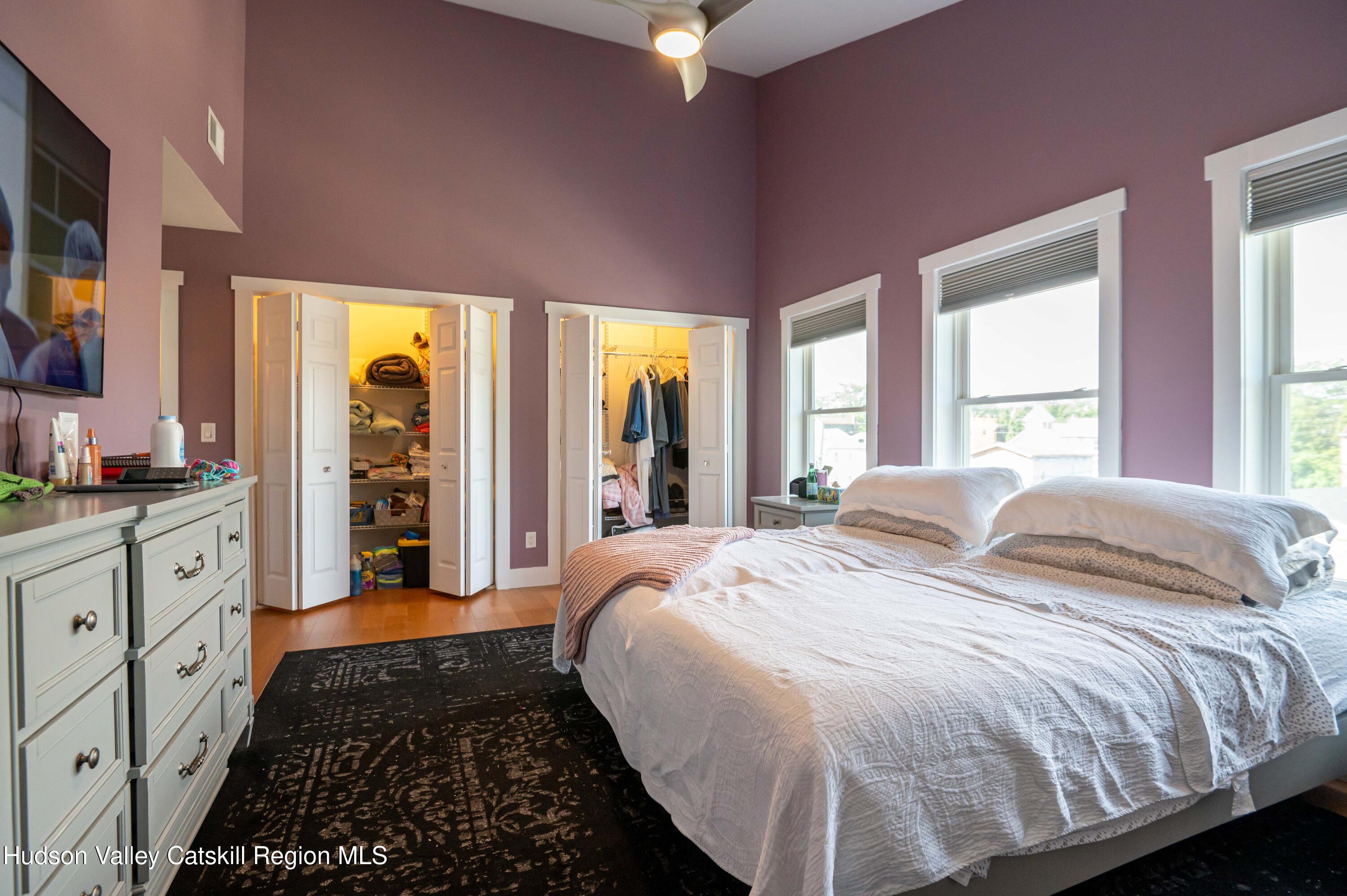 225 State Street, Unit RIGHT Hudson, NY 12534 - Photo 21 of 29 a bed room with a bed and a large window