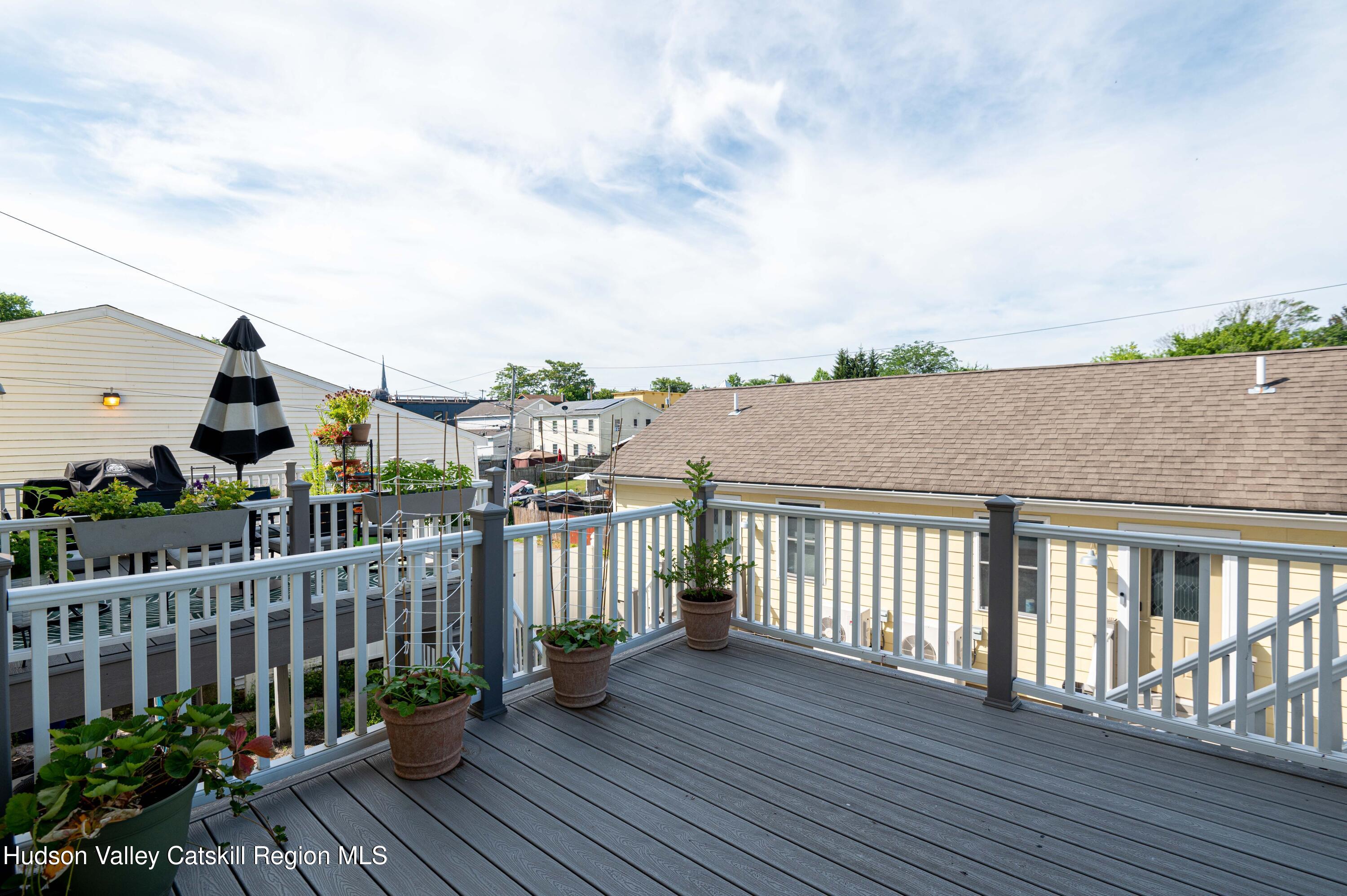 225 State Street, Unit RIGHT Hudson, NY 12534 - Photo 25 of 29 a balcony with wooden floor