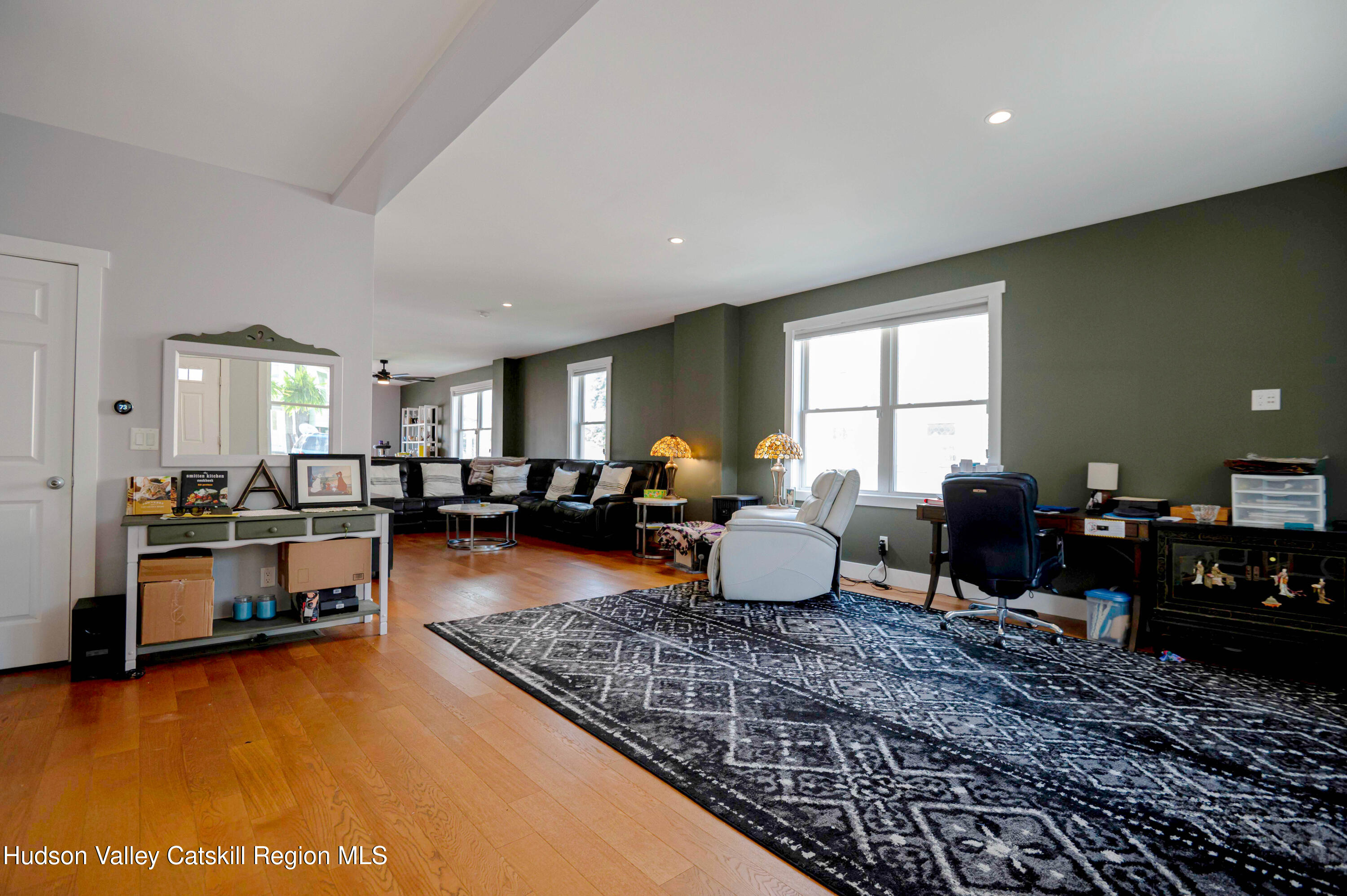 225 State Street, Unit RIGHT Hudson, NY 12534 - Photo 6 of 29 a living room with furniture or couch and a dining table