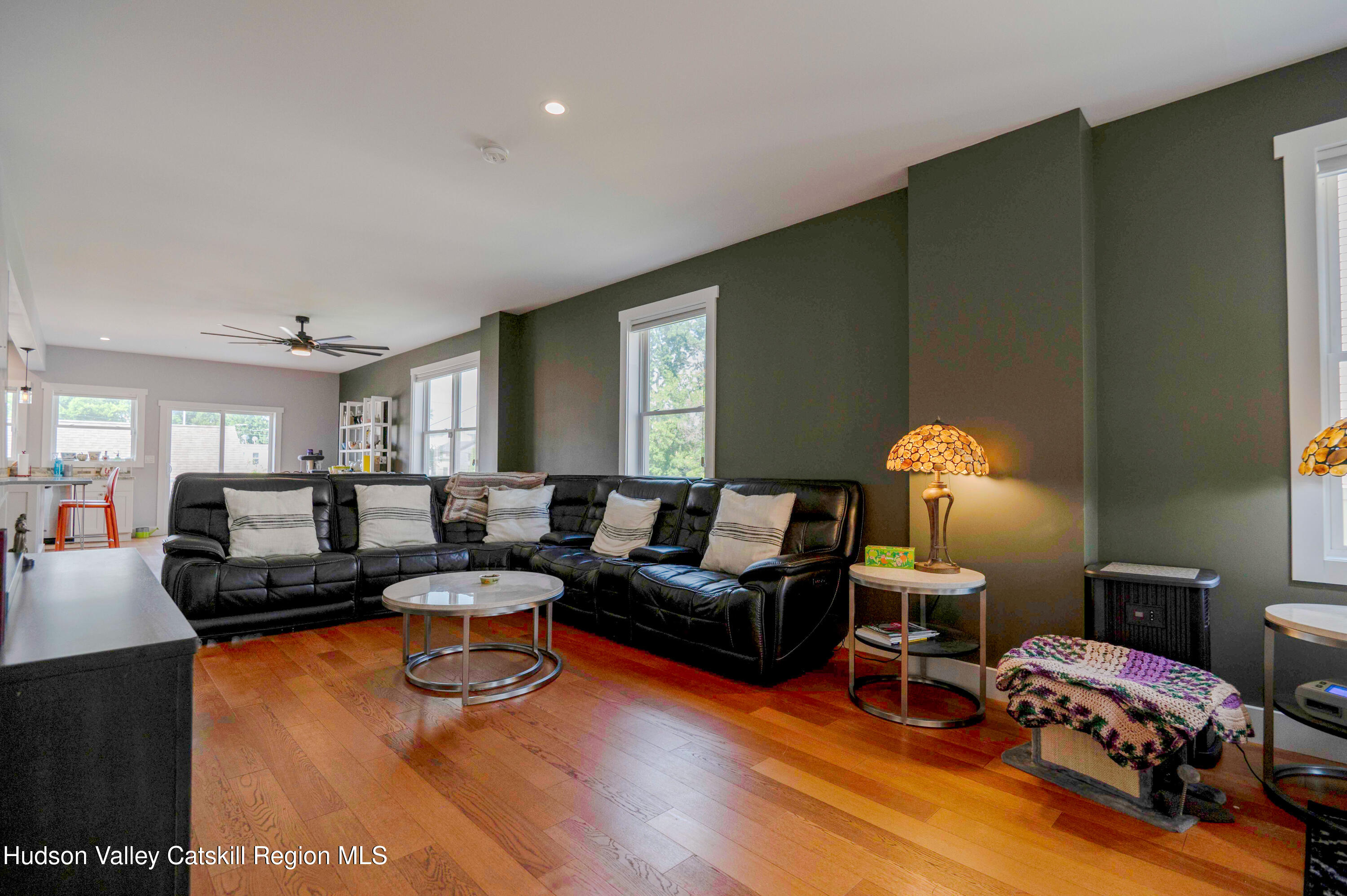 225 State Street, Unit RIGHT Hudson, NY 12534 - Photo 9 of 29 a living room with furniture and a wooden floor
