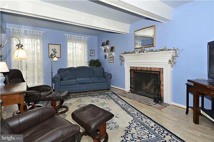 14424 Basingstoke Lane Silver Spring, MD 20905 - Photo 13 of 29 a living room with furniture and a fireplace