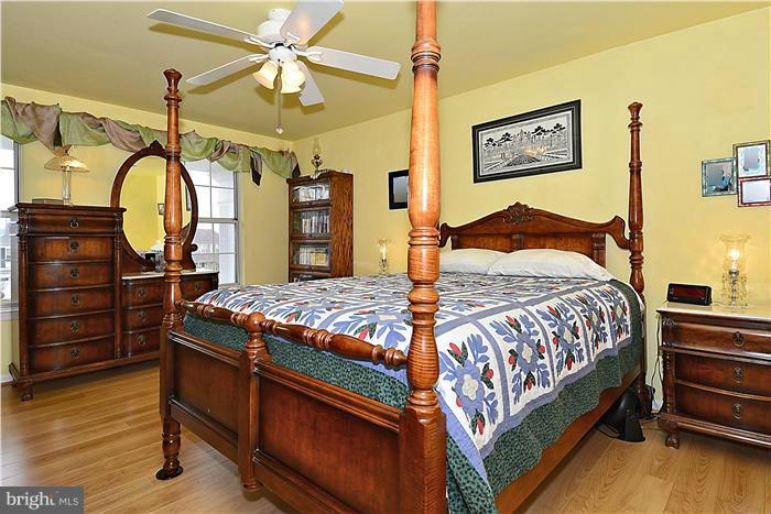 14424 Basingstoke Lane Silver Spring, MD 20905 - Photo 18 of 29 a bedroom with a bed dresser and a window
