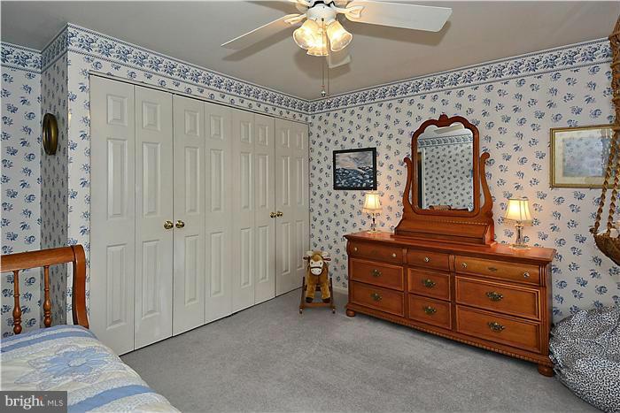 14424 Basingstoke Lane Silver Spring, MD 20905 - Photo 22 of 29 a bedroom with a bed and a dresser
