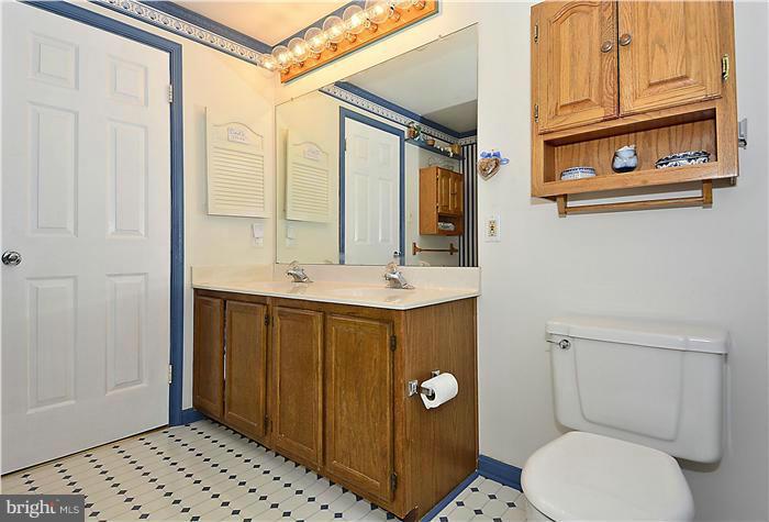 14424 Basingstoke Lane Silver Spring, MD 20905 - Photo 24 of 29 a bathroom with a sink a toilet and shower
