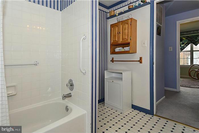 14424 Basingstoke Lane Silver Spring, MD 20905 - Photo 25 of 29 a bathroom with a bathtub and a shower