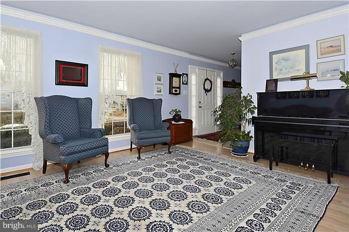14424 Basingstoke Lane Silver Spring, MD 20905 - Photo 4 of 29 a living room with furniture and a fireplace