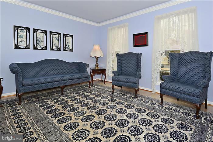 14424 Basingstoke Lane Silver Spring, MD 20905 - Photo 5 of 29 a living room with furniture and a rug