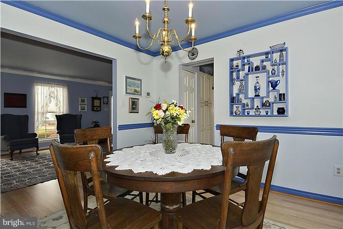 14424 Basingstoke Lane Silver Spring, MD 20905 - Photo 7 of 29 a view of a dining room with furniture and wooden floor