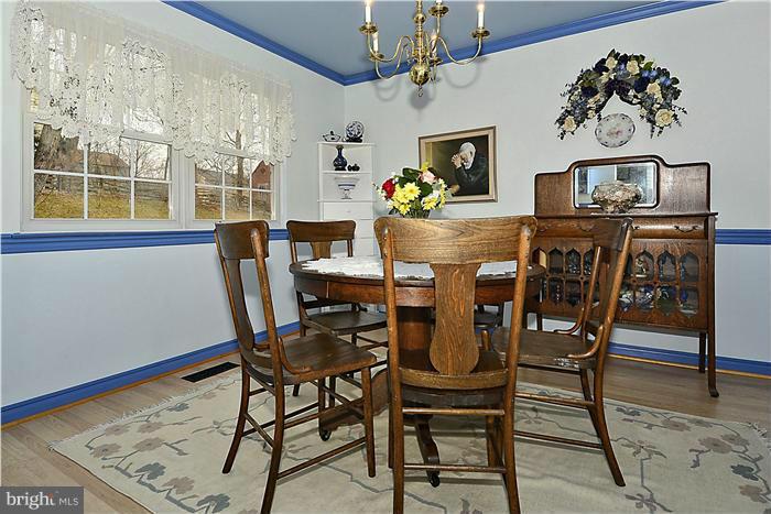 14424 Basingstoke Lane Silver Spring, MD 20905 - Photo 8 of 29 a view of a dining room with furniture and a window