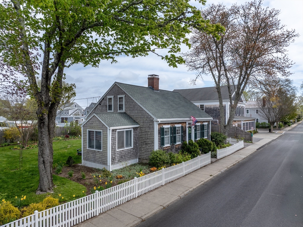 31 Main Street Marion, MA 02738 - Photo 21 of 29 a front view of a house with a yard and trees