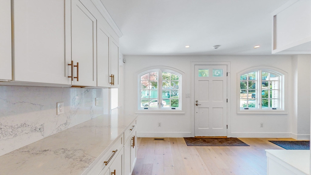 22 Puritan Road Newton, MA 02461 - Photo 25 of 37 an empty room with wooden floor and windows