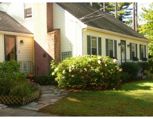 87 Concord Road Acton, MA 01720 - Photo 8 of 9 a view of a house with a garden