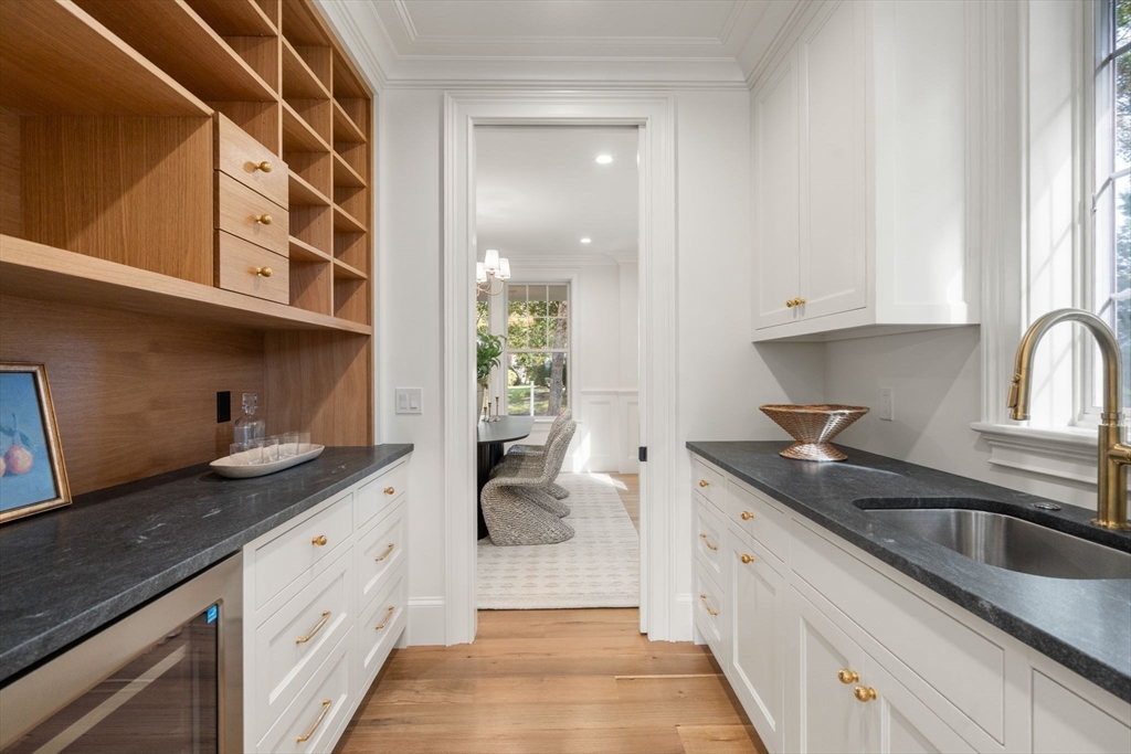 32 South Woodside Avenue Wellesley, MA 02482 - Photo 12 of 42 a kitchen with granite countertop a sink and cabinets