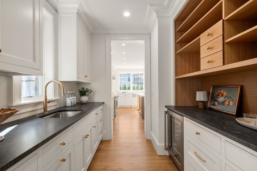 32 South Woodside Avenue Wellesley, MA 02482 - Photo 13 of 42 a kitchen with granite countertop stainless steel appliances a sink and cabinets