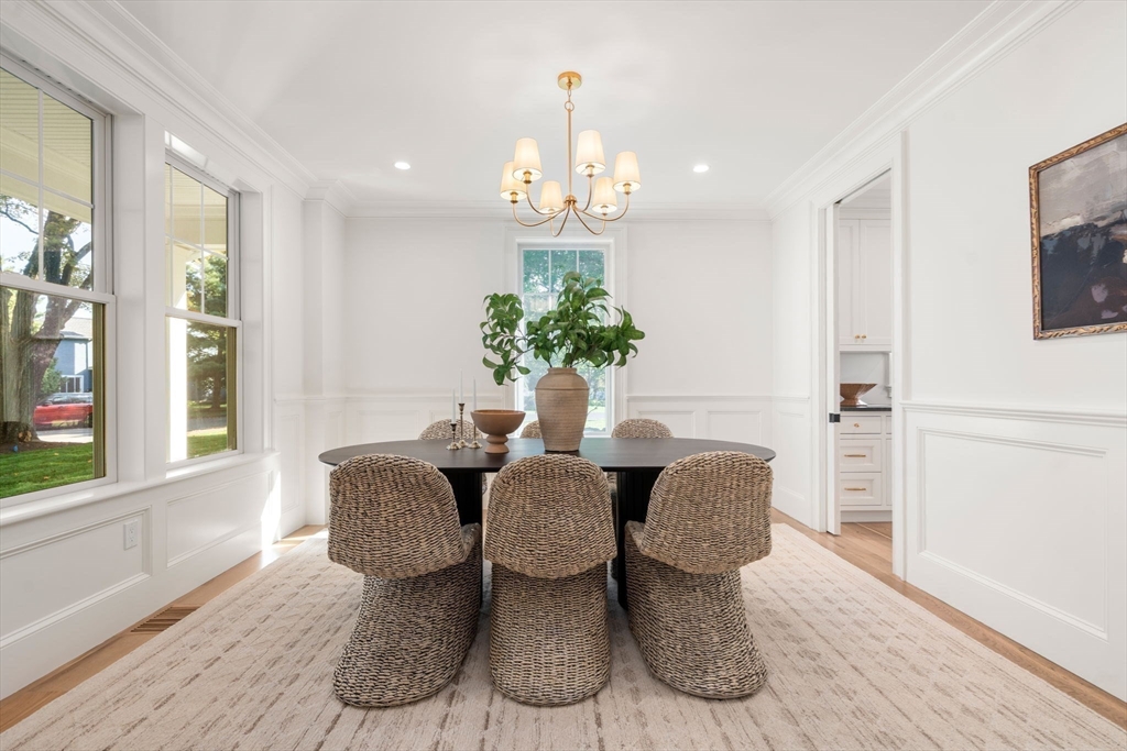 32 South Woodside Avenue Wellesley, MA 02482 - Photo 20 of 42 a view of a dining room with furniture and a chandelier