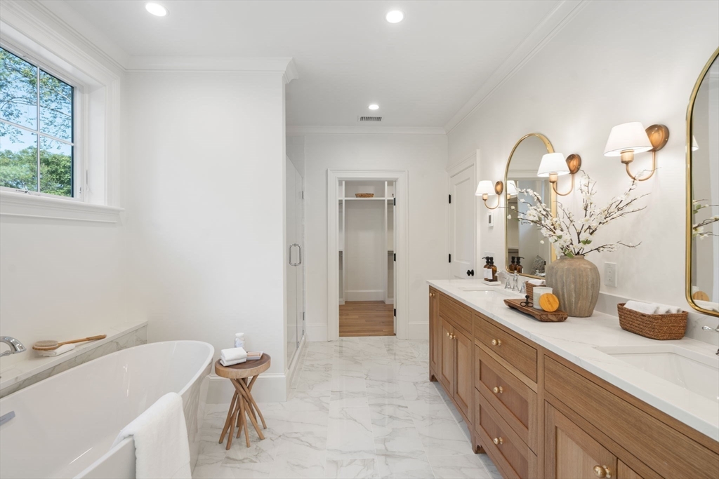 32 South Woodside Avenue Wellesley, MA 02482 - Photo 26 of 42 a bathroom with a sink a mirror and a shower