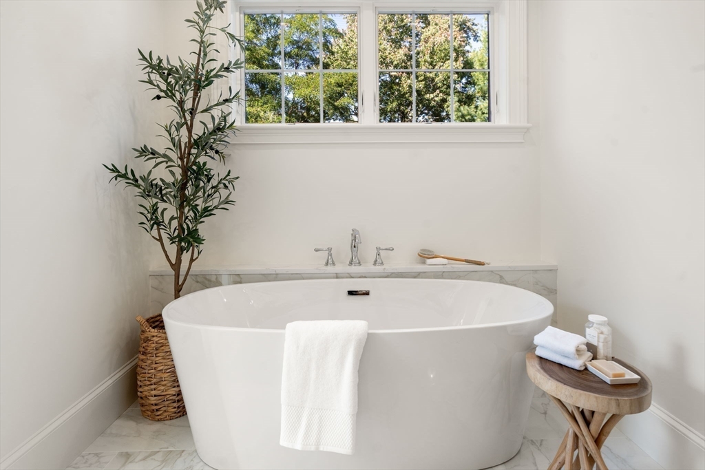 32 South Woodside Avenue Wellesley, MA 02482 - Photo 27 of 42 a white bath tub sitting in a bathroom