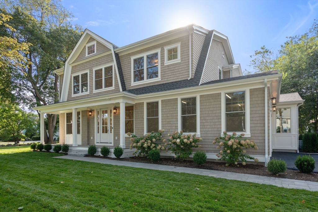32 South Woodside Avenue Wellesley, MA 02482 - Photo 3 of 42 a front view of a house with a yard