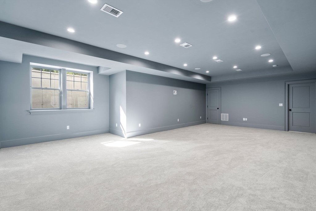 32 South Woodside Avenue Wellesley, MA 02482 - Photo 35 of 42 an empty room with windows and pillars in it