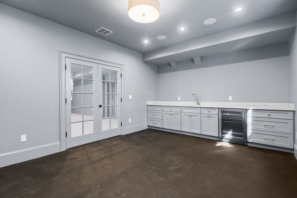 32 South Woodside Avenue Wellesley, MA 02482 - Photo 37 of 42 an empty room with furniture and natural light