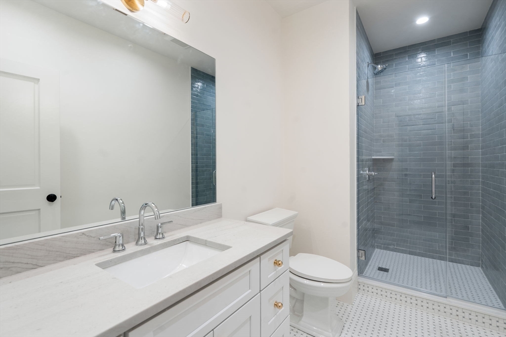 32 South Woodside Avenue Wellesley, MA 02482 - Photo 38 of 42 a bathroom with a granite countertop sink toilet and shower