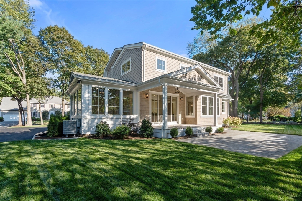 32 South Woodside Avenue Wellesley, MA 02482 - Photo 39 of 42 a front view of a house with a yard