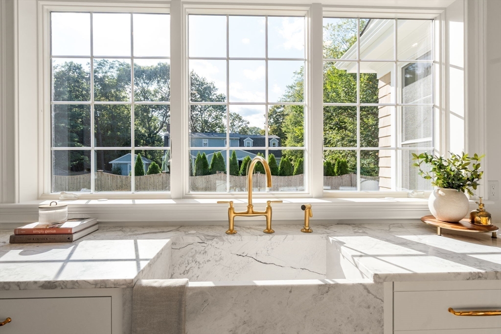 32 South Woodside Avenue Wellesley, MA 02482 - Photo 6 of 42 a living room filled with furniture and floor to ceiling windows