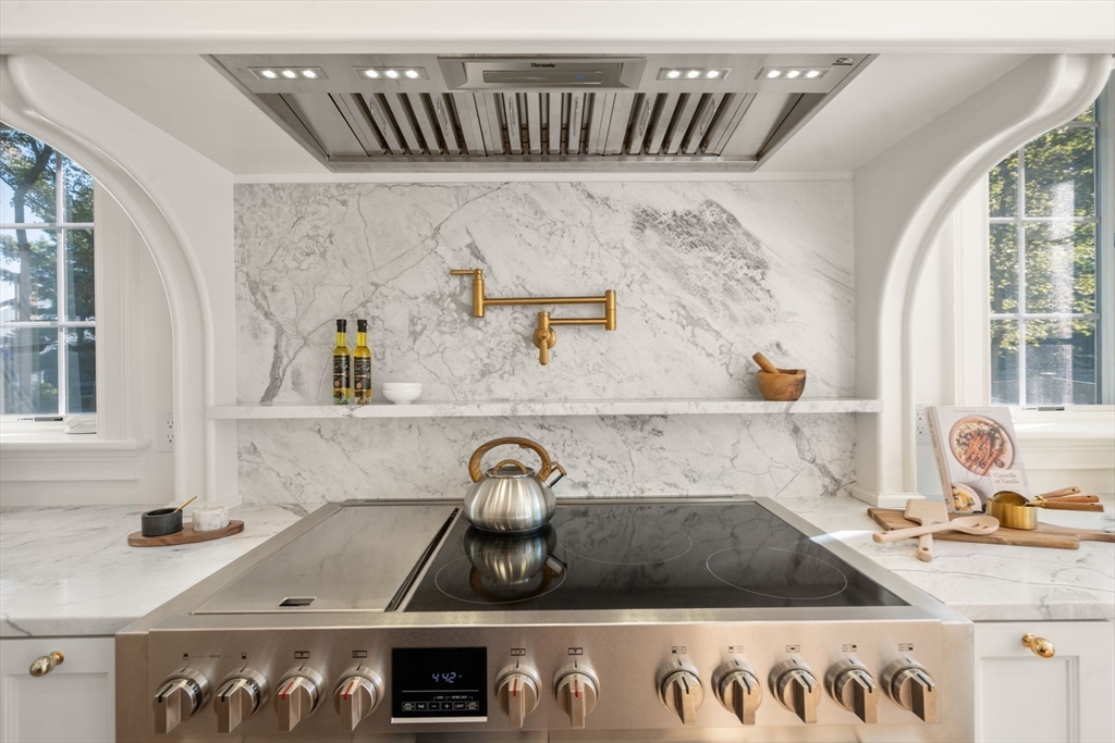 32 South Woodside Avenue Wellesley, MA 02482 - Photo 8 of 42 a kitchen with a sink and a stove