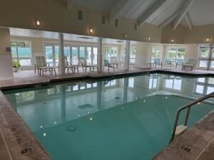1 Upland Circle, Unit 1 Mashpee, MA 02649 - Photo 25 of 39 a view of a swimming pool and window