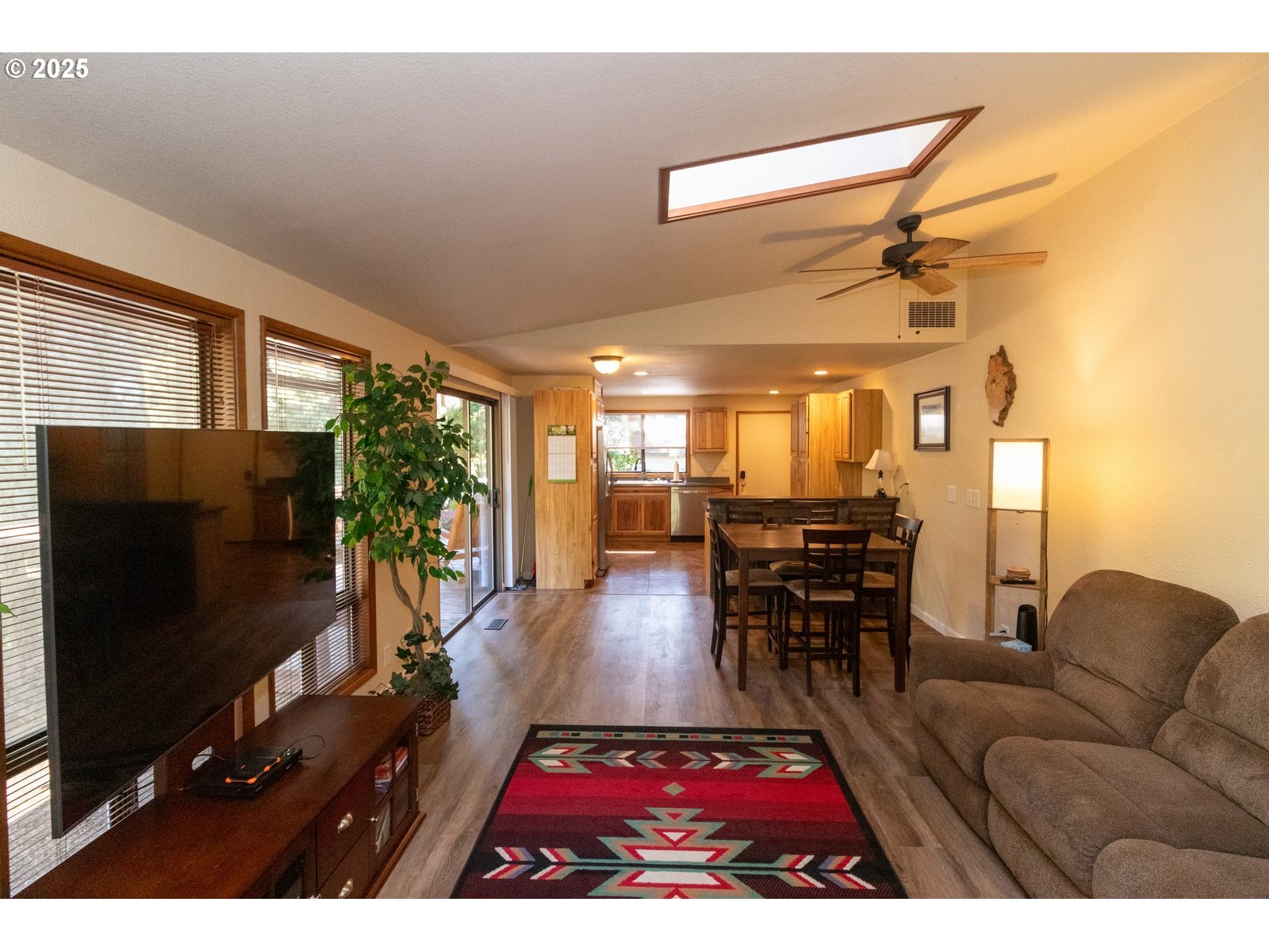 83694 Erhart Road Florence, OR 97439 - Photo 11 of 31 a living room with furniture and a flat screen tv