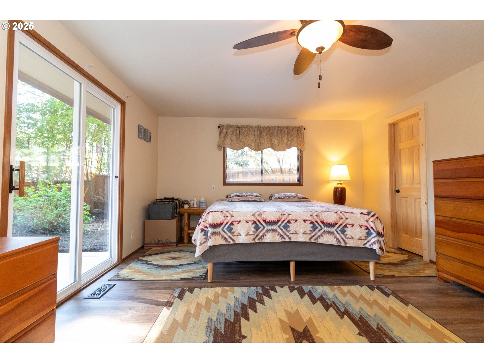 83694 Erhart Road Florence, OR 97439 - Photo 12 of 31 a bedroom with a bed mirror and window