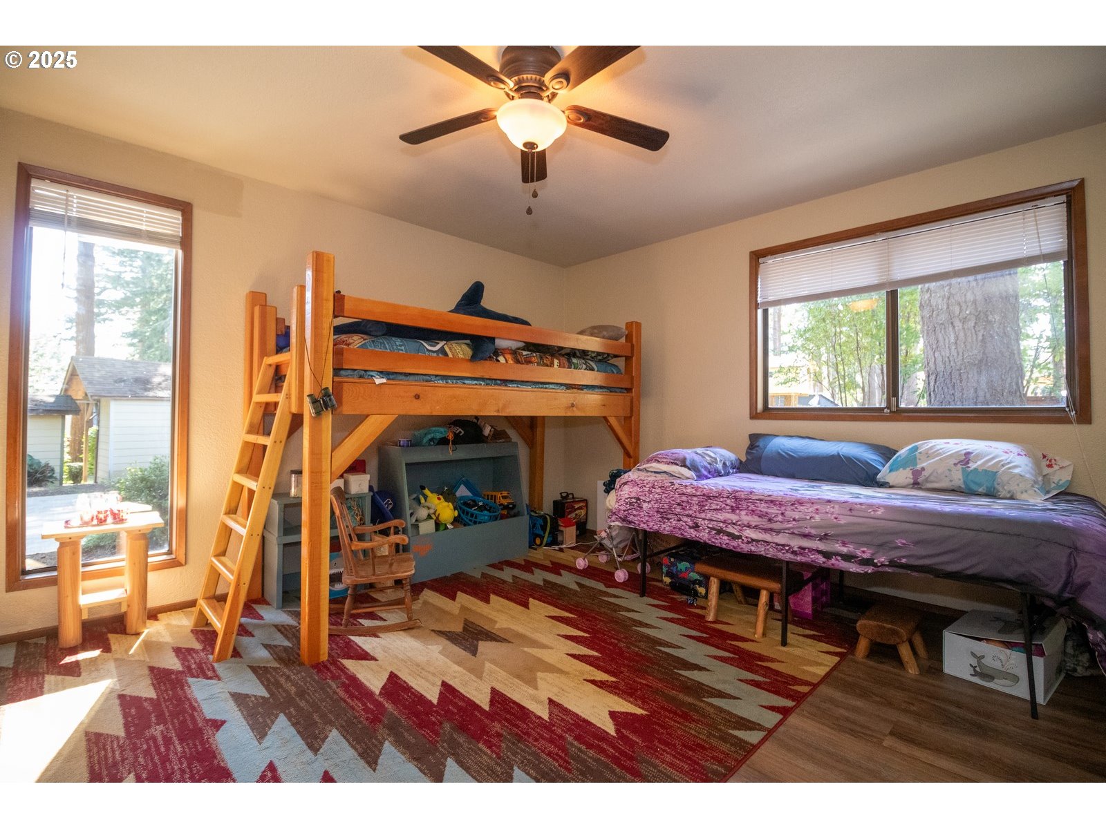 83694 Erhart Road Florence, OR 97439 - Photo 17 of 31 a bed room with furniture and a fireplace