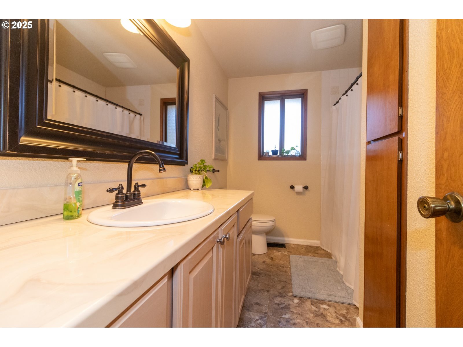 83694 Erhart Road Florence, OR 97439 - Photo 19 of 31 a bathroom with a sink and a mirror