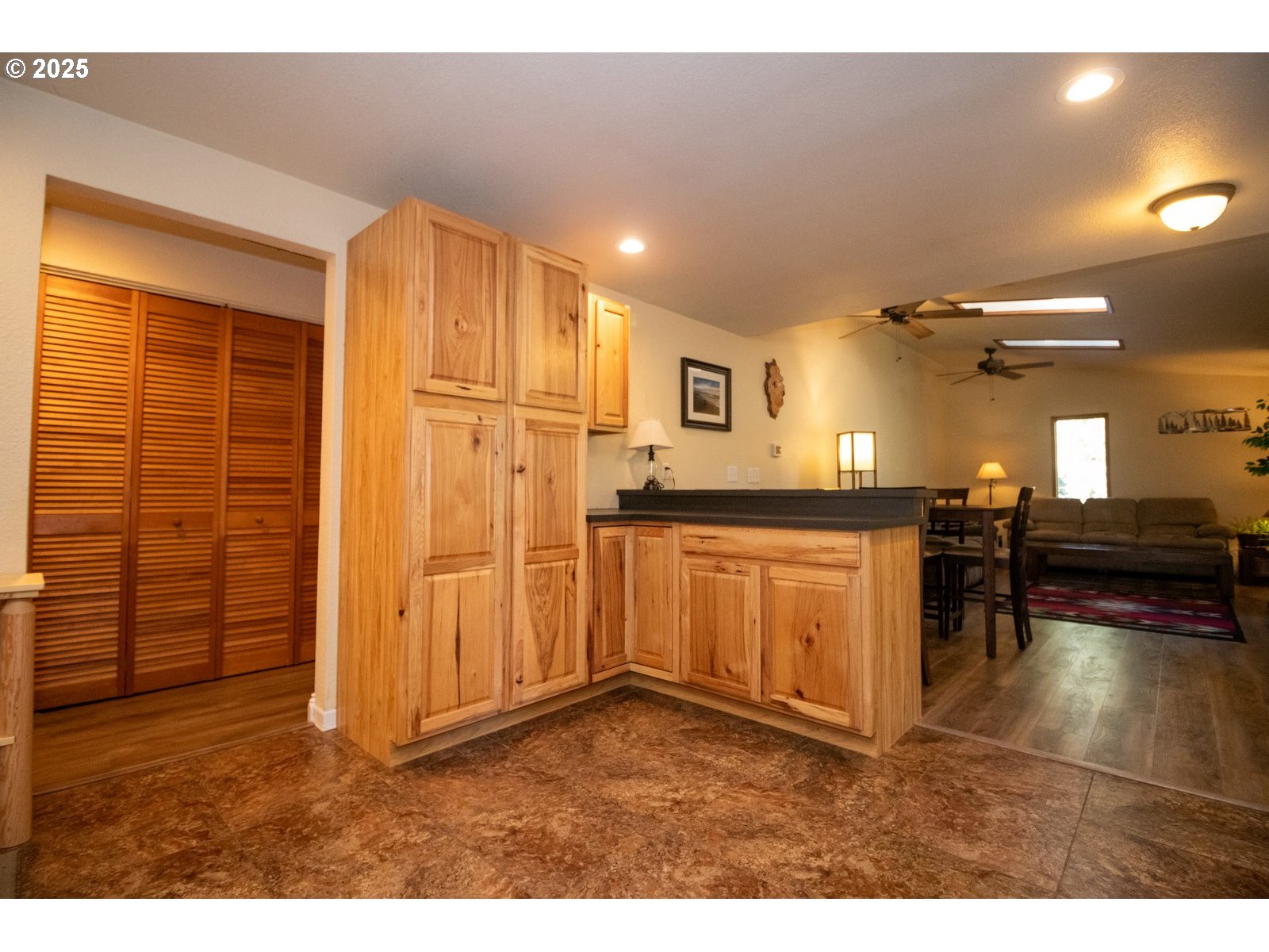 83694 Erhart Road Florence, OR 97439 - Photo 7 of 31 a kitchen with granite countertop a refrigerator and cabinets